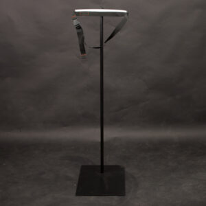 Stand with a strap attachment around the waist for flexible mannequins