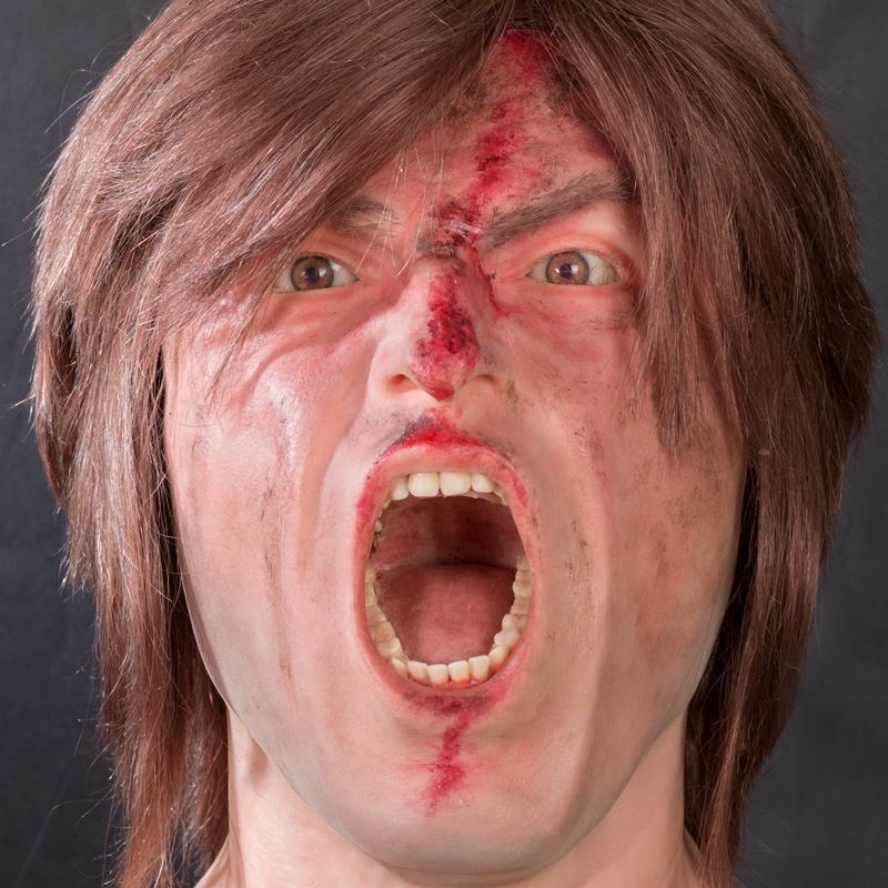Gewonde en schreeuwende man siliconen hoofd