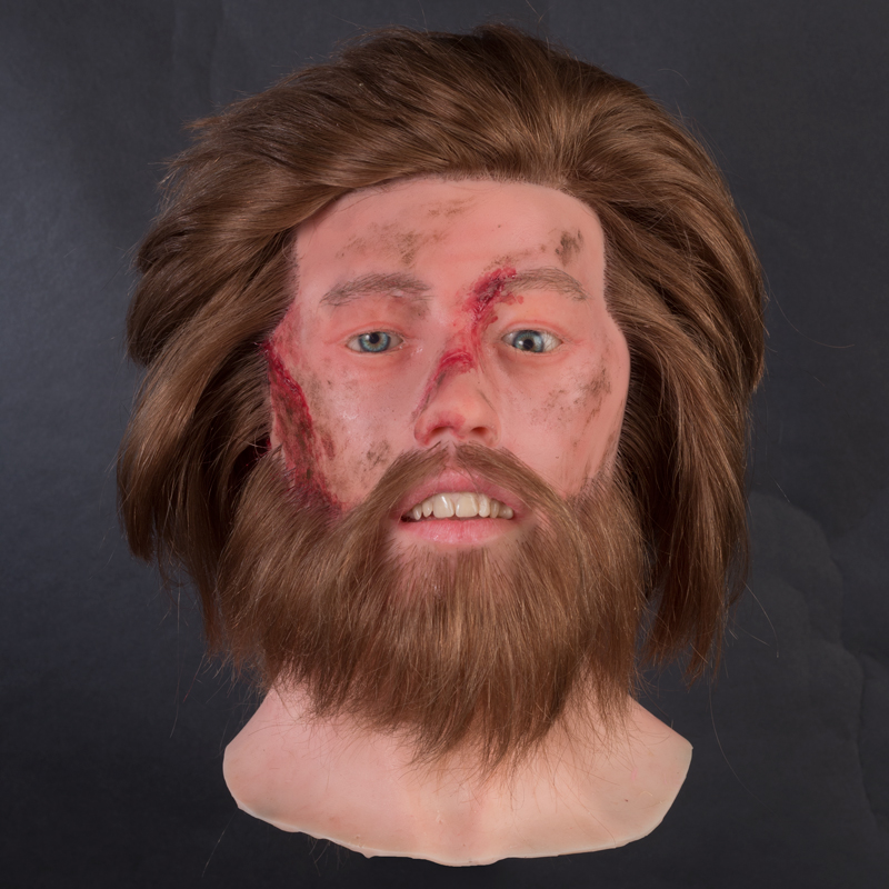 Heren siliconenhoofd met verwondingen
