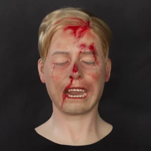 Realistic wounded teenage boy display head with toupet