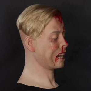 Realistic wounded teenage boy display head with toupet