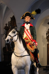 Count Maximilian Anton Karl Baillet de Latour at display horse