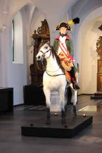 Count Maximilian Anton Karl Baillet de Latour at display horse