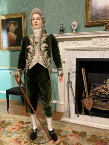 Realistic display figure lord in historical clothing in state rooms in Bowood House