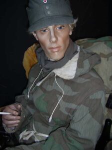 Militaria collection displayed on mannequin