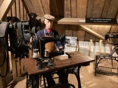 Mannequin of a harness maker/leather worker at the Goemanszorg museum farm