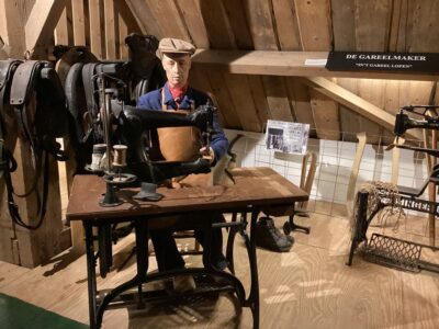 Mannequin of a harness maker/leather worker at the Goemanszorg museum farm