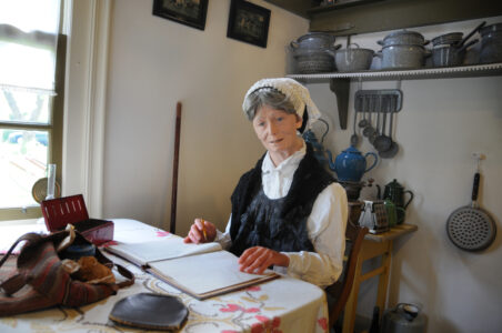Grandmother in kitchen display mannequin