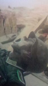 Mannequin of a German WW2 soldier screams because he is trapped under an armored vehicle.