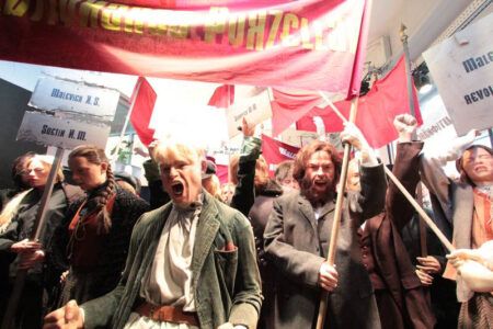 Revolutionary parade of display mannequins in realistic poses with lifelike silicone heads and hands.
