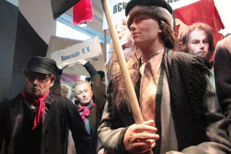 Revolutionary parade of display mannequins in realistic poses with lifelike silicone heads and hands.