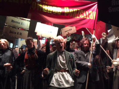Revolutionary parade of display mannequins in realistic poses with lifelike silicone heads and hands.
