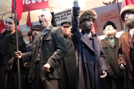 Revolutionary parade of display mannequins in realistic poses with lifelike silicone heads and hands.